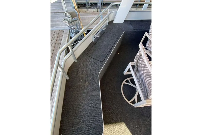 Slide: The Image of Interior view of 2007 Summerset houseboat with carpeted flooring and natural light. - 362