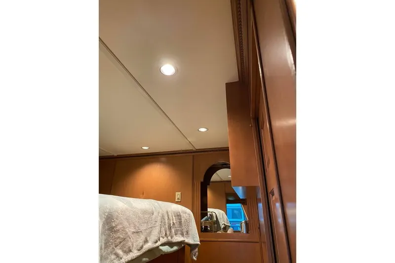 Slide: The Image of Interior view of 2007 Summerset houseboat hallway with wooden cabinetry and carpeted floor. - 37