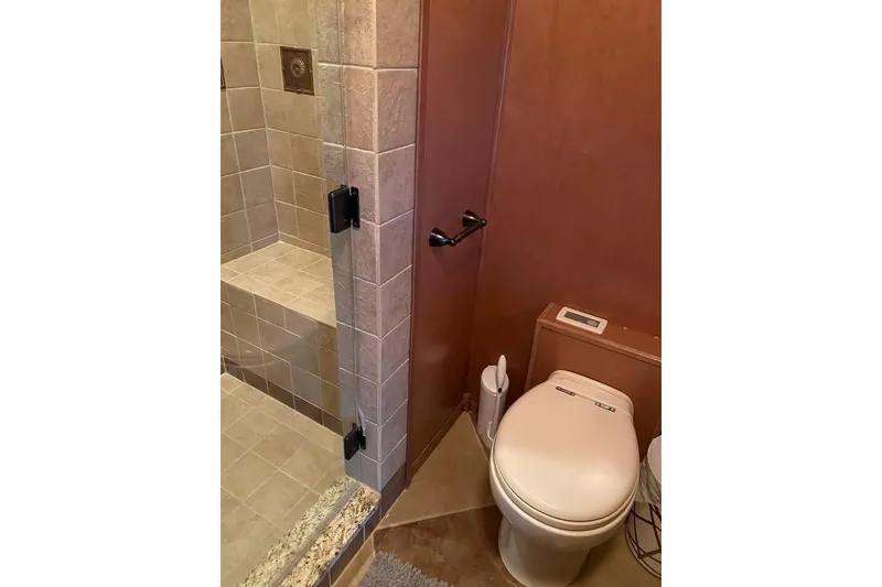 Slide: The Image of Interior of 2007 Summerset houseboat, featuring wood paneling and recessed lighting. - 40