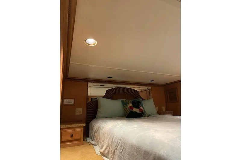 Slide: The Image of Luxurious interior of 2007 Summerset houseboat with elegant lighting and wood accents. - 48