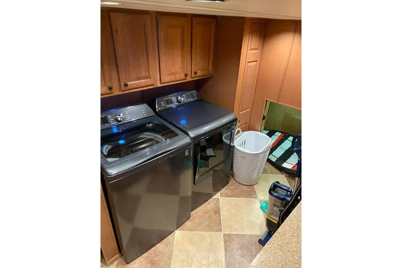 Slide: The Image of Cozy bedroom interior in 2007 Summerset houseboat, featuring a plush bed and decorative pillow. - 51