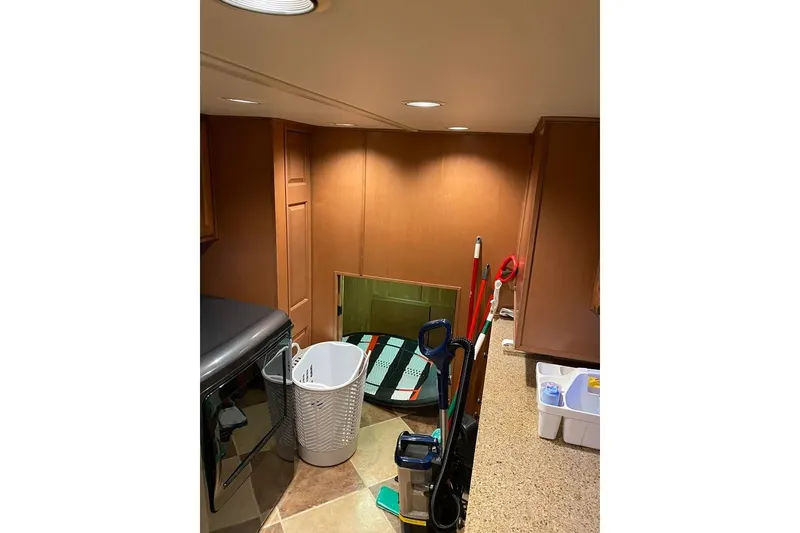 Slide: The Image of Interior of 2007 Summerset houseboat, featuring a cozy bedroom with wooden accents. - 52