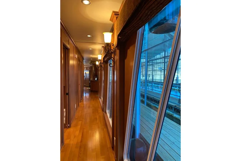 Slide: The Image of Laundry room with cleaning supplies and a basket in a Summerset 21' x 106' houseboat. - 55