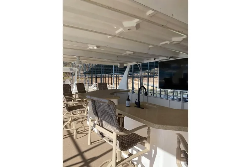 Slide: The Image of Spacious upper deck of 2007 Summerset houseboat with seating and ceiling fans. - 66
