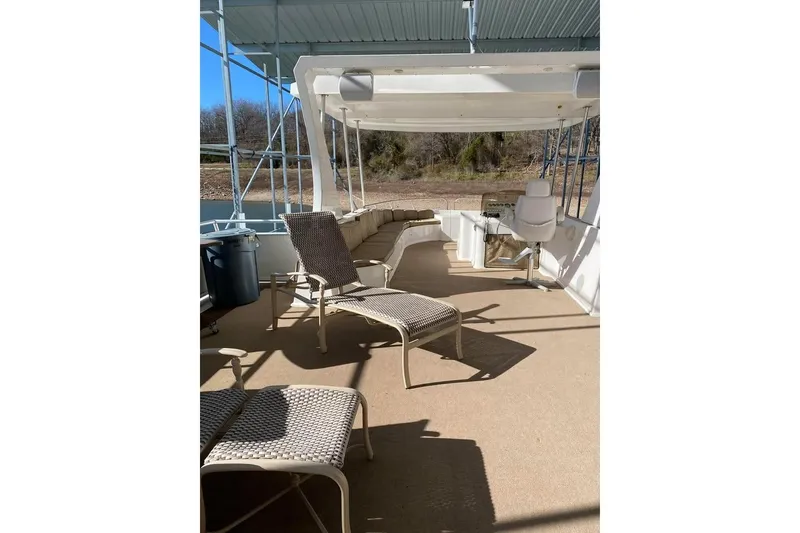 Slide: The Image of Ceiling fan on a 2007 Summerset houseboat, overlooking a serene lake view. - 67