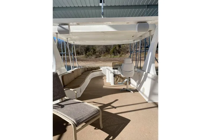 Slide: The Image of Luxurious outdoor bar area on 2007 Summerset houseboat, featuring seating and a TV. - 69