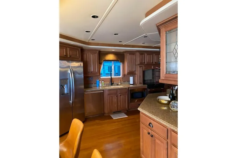 Slide: The Image of Pilothouse interior of 2007 Summerset 21' x 106' houseboat with wooden accents. - 7