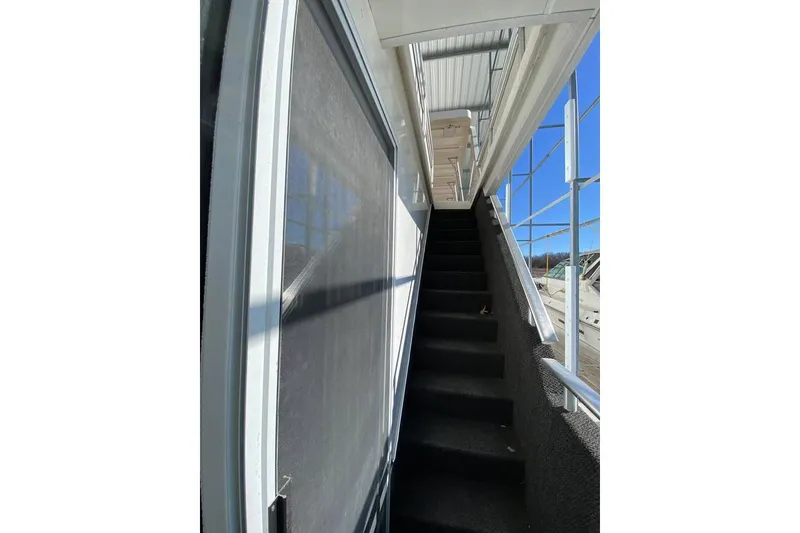 Slide: The Image of Luxurious 2007 Summerset houseboat interior with seating and helm, model 21' x 106'. - 72