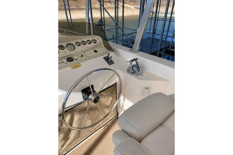 Slide: The Image of Spacious deck of 2007 Summerset houseboat with seating and helm, under metal canopy. - 73
