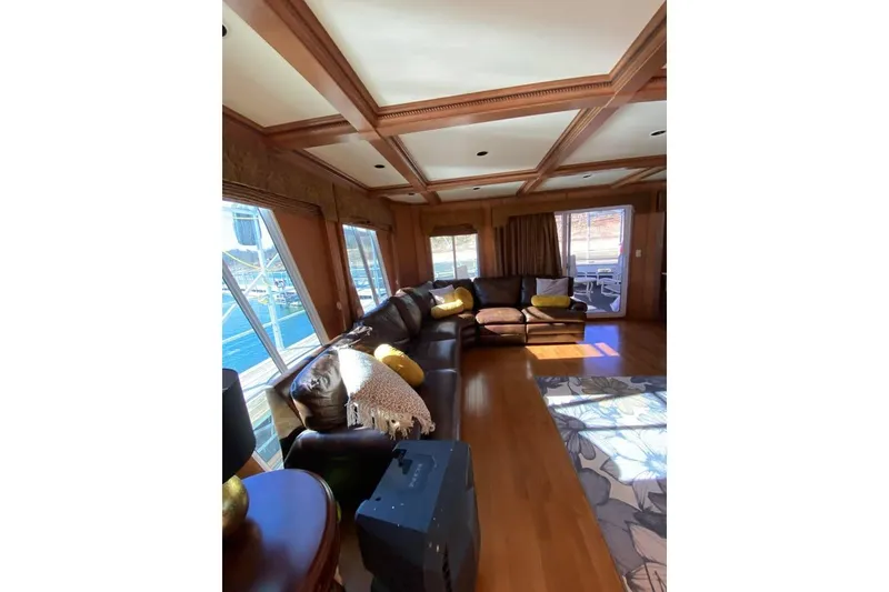 Slide: The Image of Luxurious interior of 2007 Summerset houseboat with modern kitchen and cozy seating area. - 77