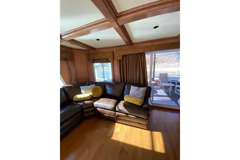 Slide: The Image of Luxurious interior of 2007 Summerset houseboat, featuring wood paneling and comfortable seating. - 78