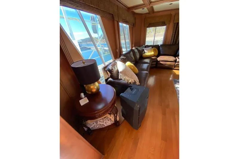 Slide: The Image of Luxurious interior of a 2007 Summerset houseboat, featuring elegant wood paneling and modern furnishings. - 79