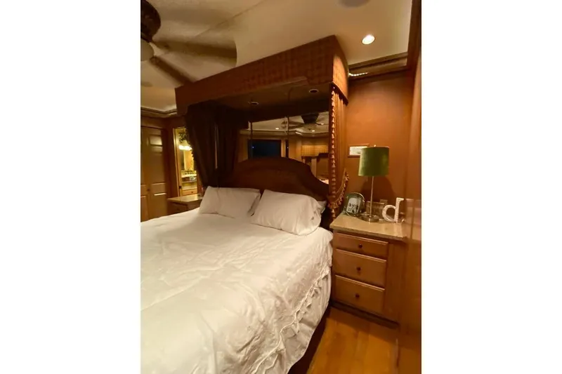 Slide: The Image of Luxurious kitchen interior with elegant lighting and decorative centerpiece on Summerset 21' x 106' houseboat. - 8