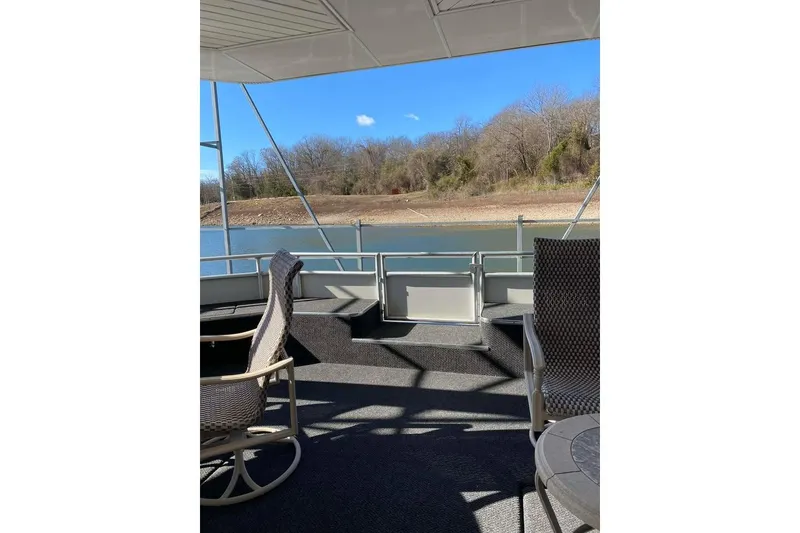 Slide: The Image of Luxury 2007 Summerset houseboat, 21' x 106', docked with spacious deck and seating. - 90