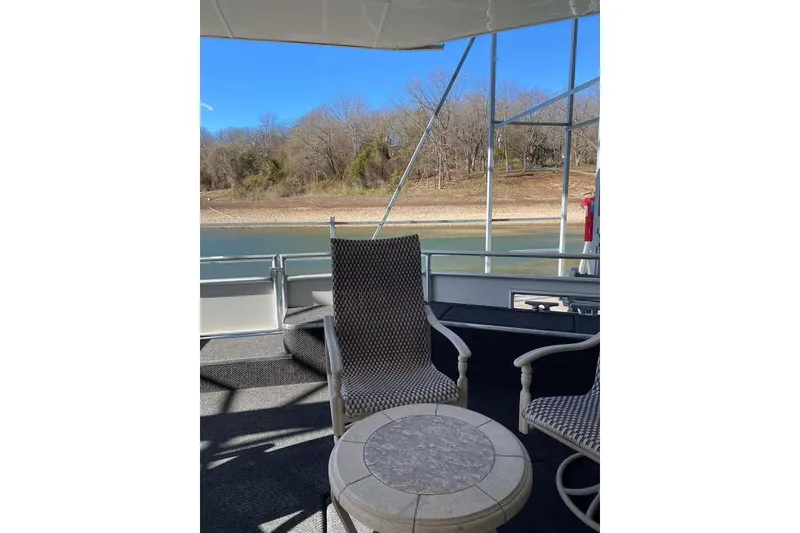 Slide: The Image of Luxury 2007 Summerset houseboat, 21' x 106', docked with spacious deck and seating area. - 92