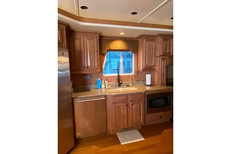 Slide: The Image of Wooden wine rack and bottles in a 2007 Summerset 21' x 106' interior. - 99