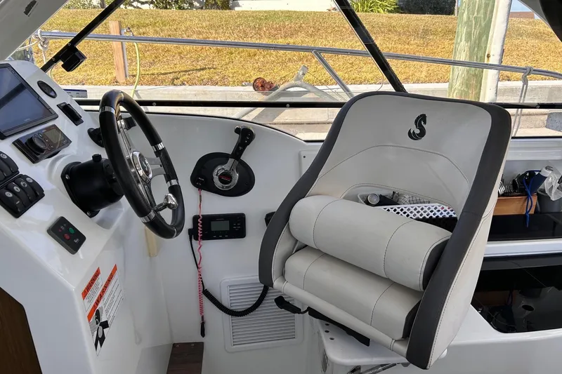 Slide: The Image of Helm of 2021 Beneteau Antares 8 with steering wheel and captain's chair. - 17