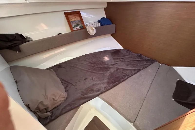 Slide: The Image of Cozy cabin interior of 2021 Beneteau Antares 8 with bed and decor. - 21