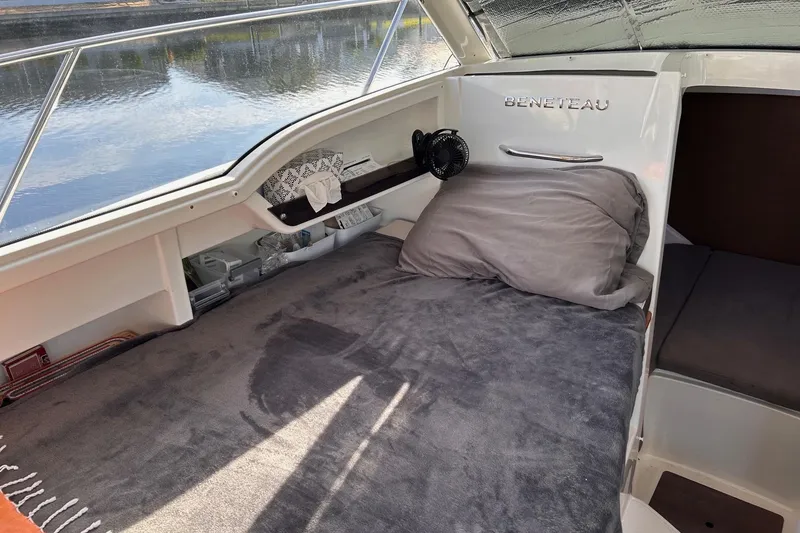 Slide: The Image of 2021 Beneteau Antares 8 cabin interior with cozy bedding and river view. - 22