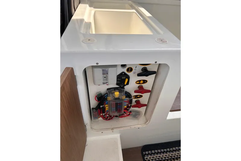 Slide: The Image of Electrical panel of 2021 Beneteau Antares 8 boat, featuring switches and wiring. - 33
