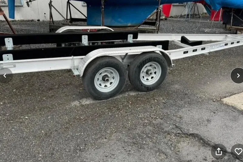 Slide: The Image of Trailer for 2021 Beneteau Antares 8 boat, parked on gravel surface. - 37