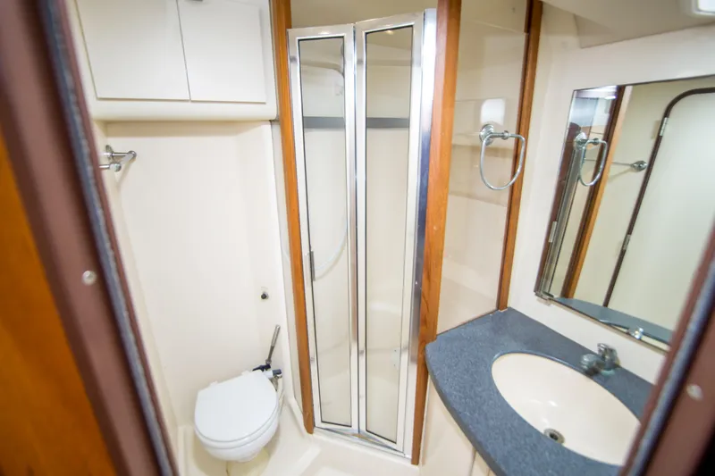 Slide: The Image of Bathroom interior of 2002 Luhrs 36 Convertible yacht with shower and sink. - 22