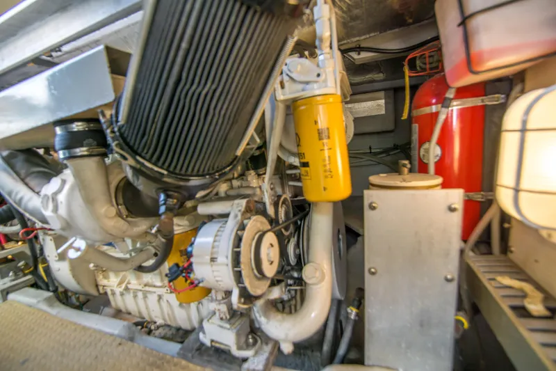 Slide: The Image of Engine room of 2002 Luhrs 36 Convertible boat, showcasing mechanical components. - 25