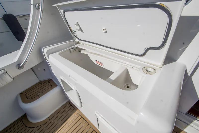 Slide: The Image of Open storage compartment on 2002 Luhrs 36 Convertible boat deck. - 26
