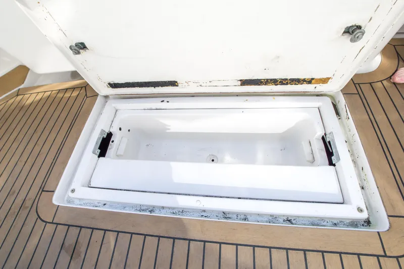 Slide: The Image of Open storage compartment on 2002 Luhrs 36 Convertible boat deck. - 27