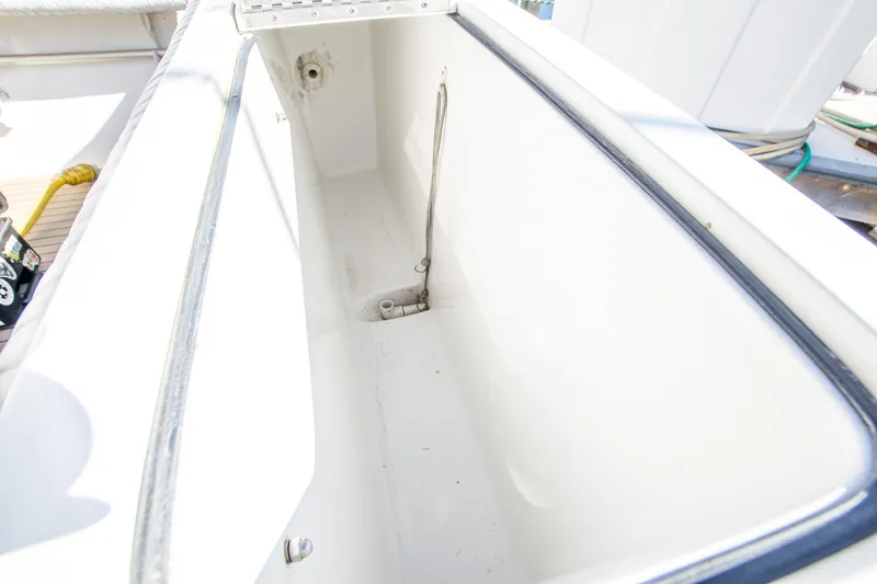 Slide: The Image of Open storage compartment on 2002 Luhrs 36 Convertible boat deck. - 28