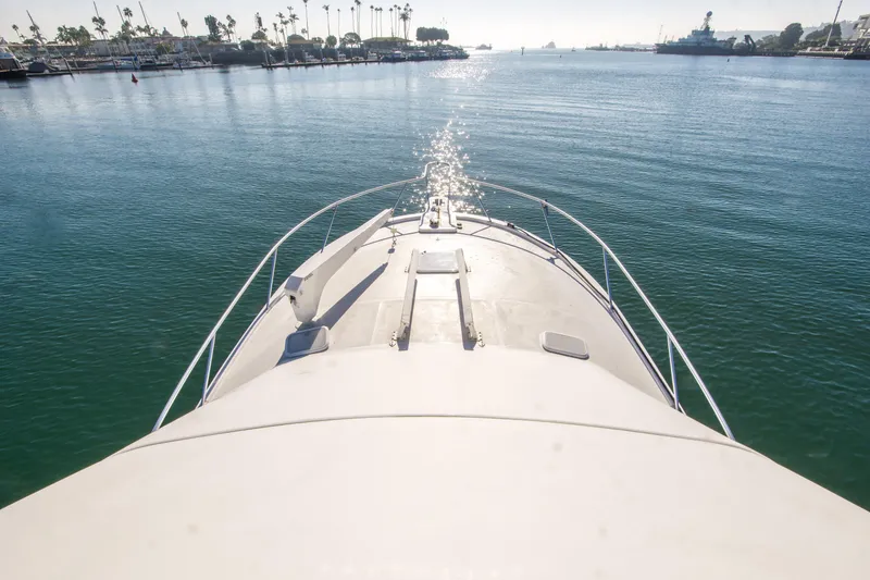 Slide: The Image of Bow view of 2002 Luhrs 36 Convertible yacht on calm water. - 8