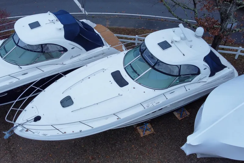 Slide: The Image of 2007 Sea Ray 40 Sundancer yacht on land, aerial view, with covered boats nearby. - 15