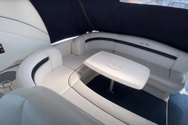 Slide: The Image of Luxurious 2007 Sea Ray 40 Sundancer interior with elegant white seating and table. - 20