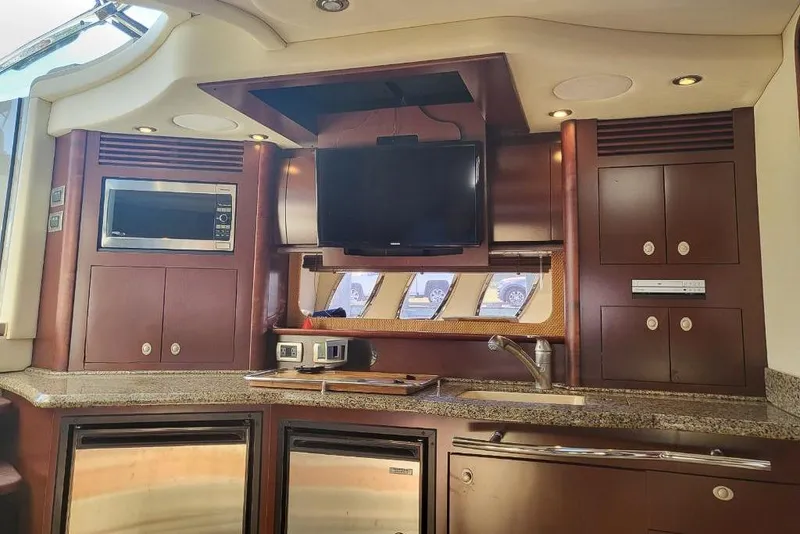 Slide: The Image of Luxurious 2007 Sea Ray 40 Sundancer yacht interior with modern kitchen amenities. - 24