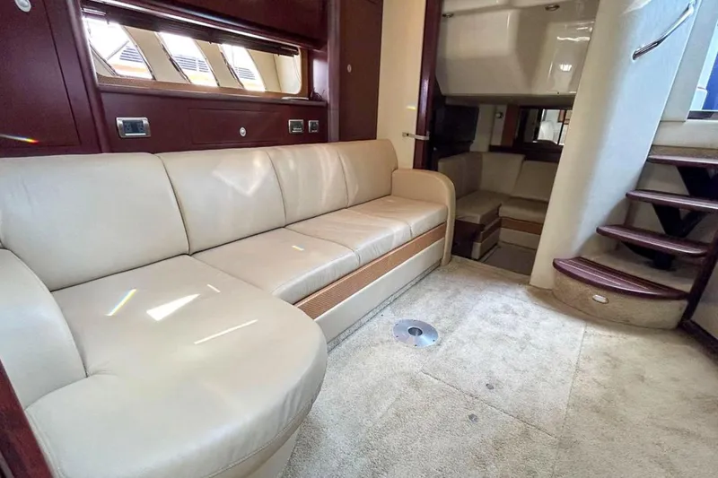 Slide: The Image of Luxurious interior of 2007 Sea Ray 40 Sundancer yacht with beige leather seating. - 27