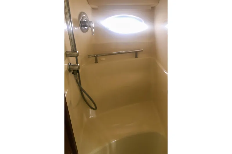 Slide: The Image of Shower area in 2007 Sea Ray 40 Sundancer yacht, featuring a handheld showerhead. - 31