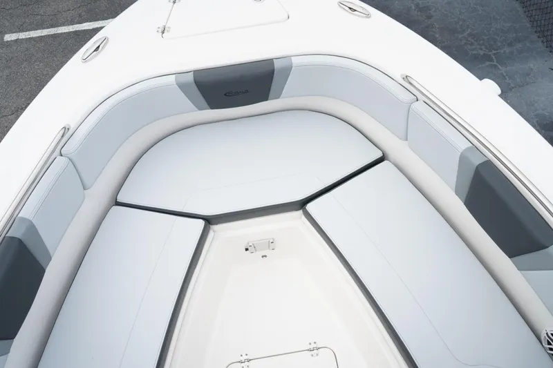 Slide: The Image of 2026 Robalo R232 Explorer boat with spacious cushioned seating area. - 10