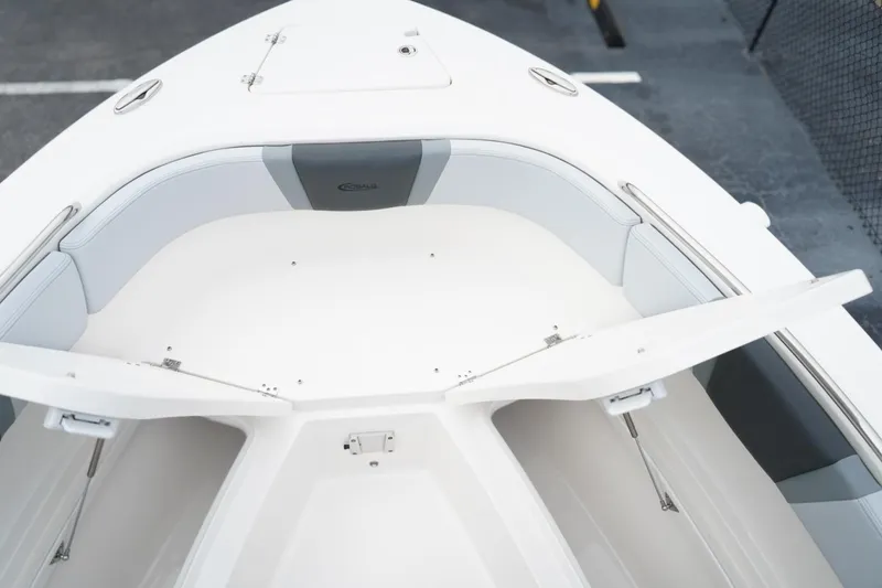 Slide: The Image of 2026 Robalo R232 Explorer boat interior with open storage compartments. - 11