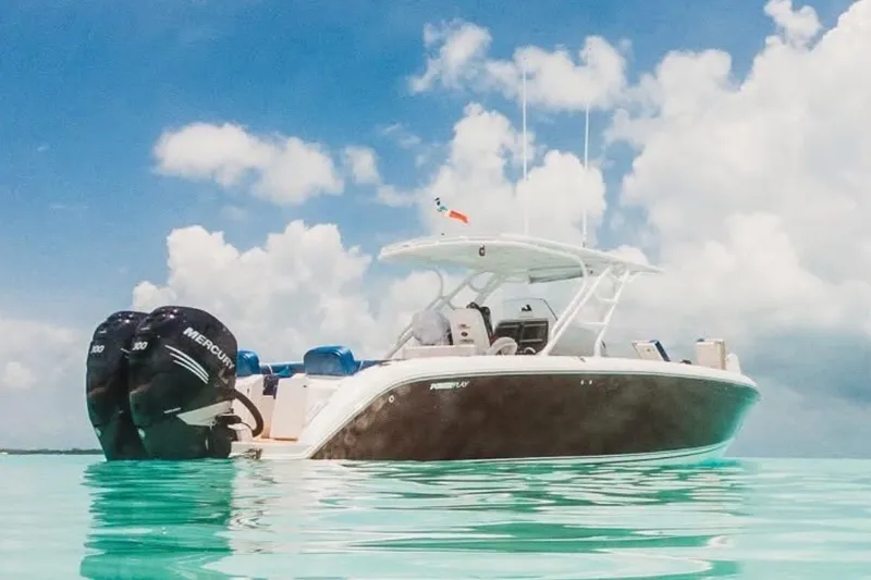 Slide: The Image of 2014 Powerplay Powerboats 35 Open on clear turquoise water under a blue sky. - 0