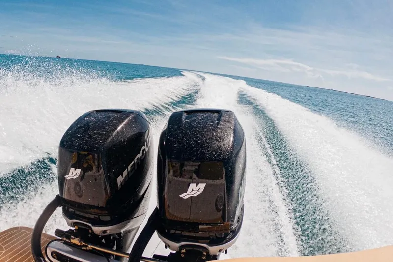 Slide: The Image of 2014 Powerplay Powerboats 35 Open speeding on open water, twin Mercury engines visible. - 3