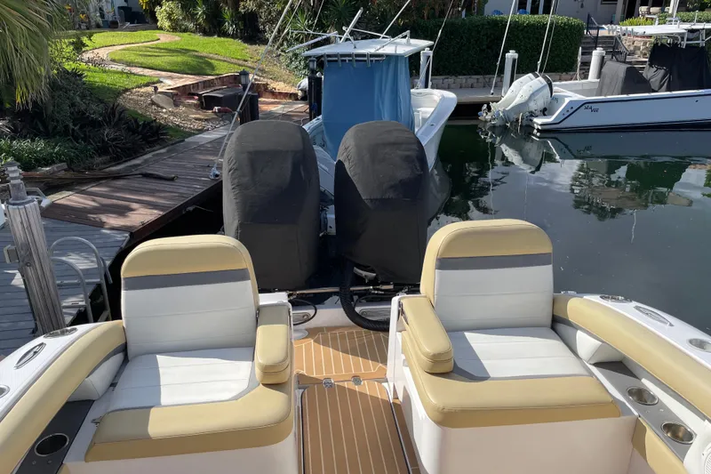 Slide: The Image of 2014 Powerplay Powerboats 35 Open with dual engines docked at a marina. - 9