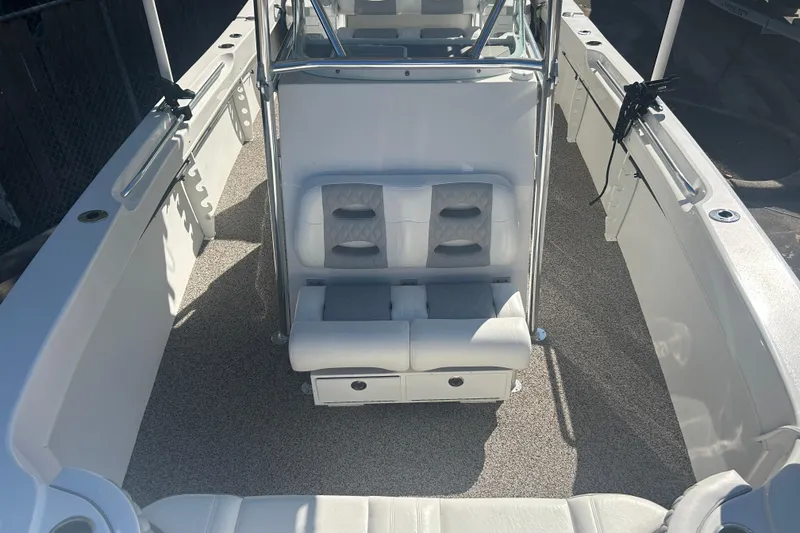 Slide: The Image of 2021 Twin Vee 260 VIVA boat interior with seating and storage compartments. - 10