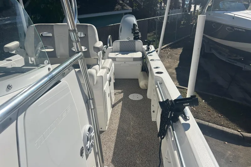Slide: The Image of 2021 Twin Vee 260 VIVA boat interior with seating and equipment. - 16