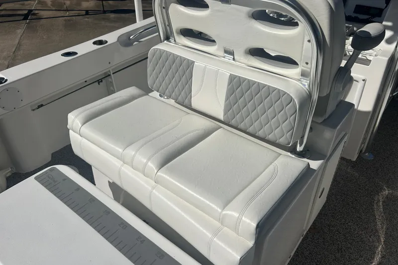 Slide: The Image of 2021 Twin Vee 260 VIVA boat interior with cushioned seating and sleek design. - 17
