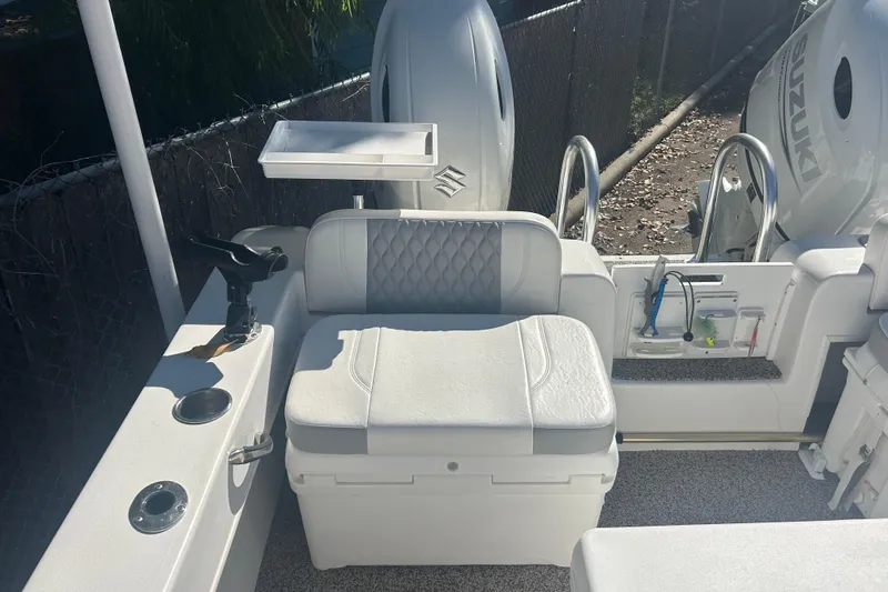 Slide: The Image of 2021 Twin Vee 260 VIVA boat interior with seating and fishing equipment. - 19