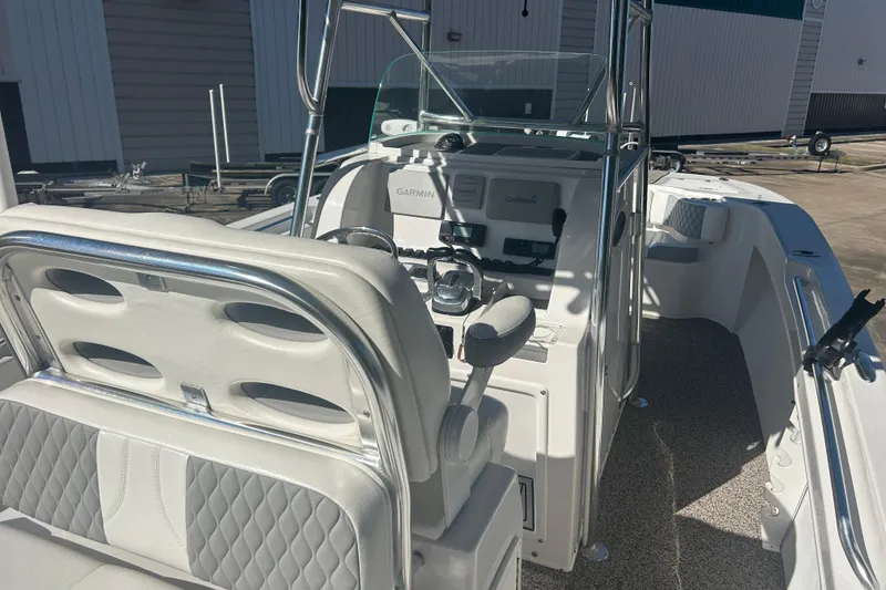 Slide: The Image of 2021 Twin Vee 260 VIVA boat interior with steering console and seating. - 22