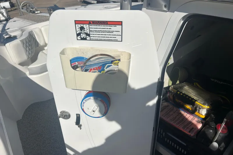Slide: The Image of Interior view of a 2021 Twin Vee 260 VIVA boat with storage compartment. - 23