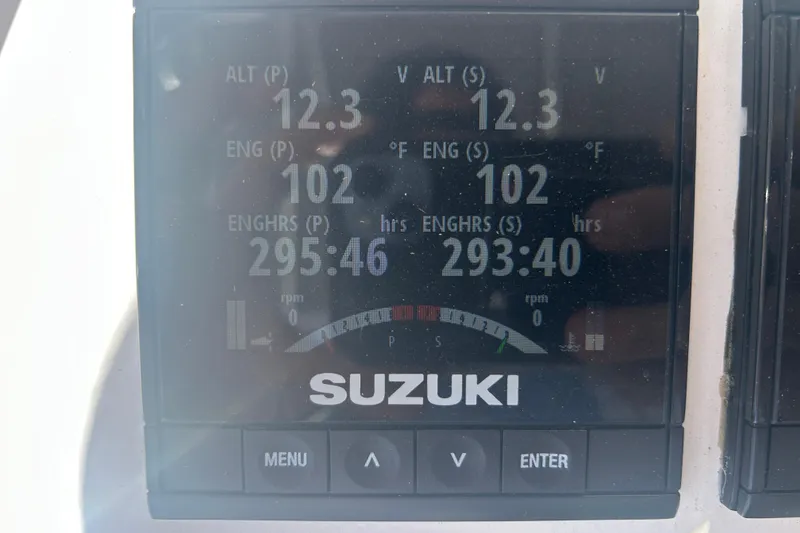 Slide: The Image of Suzuki engine display showing altimeter, engine temperature, and hours for Twin Vee 260 VIVA 2021. - 29