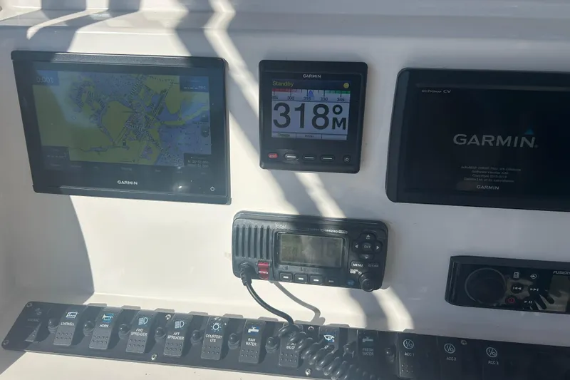 Slide: The Image of Control panel of 2021 Twin Vee 260 VIVA with Garmin navigation displays. - 30