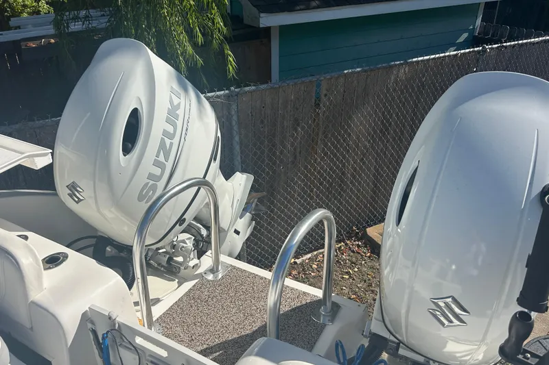 Slide: The Image of Twin Vee 260 VIVA 2021 boat with dual Suzuki outboard motors. - 32